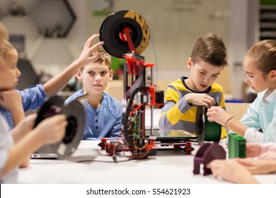 Education, Children, Technology, Science And People Concept - Group Of Happy Kids With 3d Printer At Robotics School Lesson