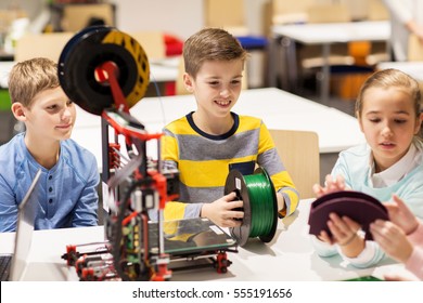 Education, Children, Technology, Science And People Concept - Group Of Happy Kids With 3d Printer At Robotics School Lesson