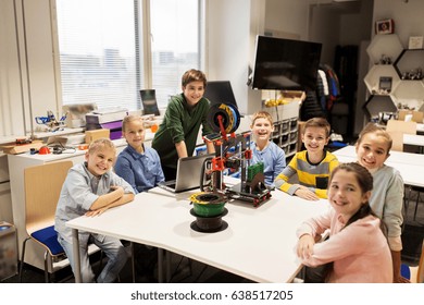 Education, Children, Technology, Science And People Concept - Group Of Happy Kids With 3d Printer And Laptop Computer At Robotics School Lesson