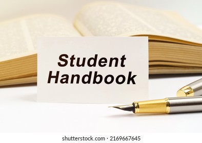 Education Concept. Against The Background Of The Book Lies A Pen And A Business Card With The Inscription - Student Handbook