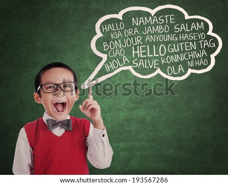 Education concept: Asian school boy learns to speak different languages in a classroom