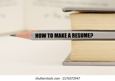 Education Concept. In The Book Between The Pages Lies A Pencil With The Inscription - How To Make A Resume