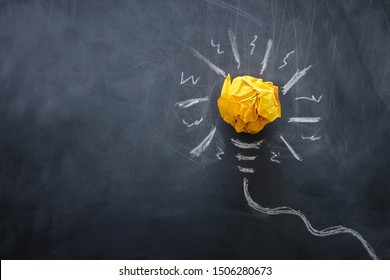 Education concept image. Creative idea and innovation. Crumpled paper as light bulb metaphor over blackboard - Shutterstock ID 1506280673