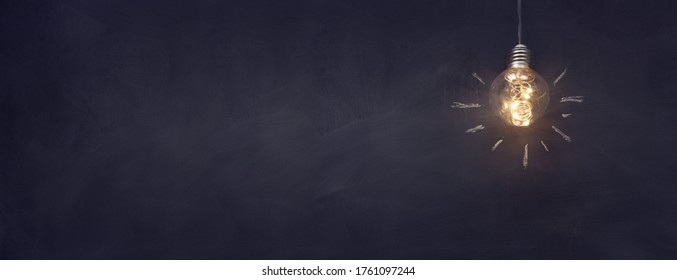 Education concept image. Creative idea and innovation. Light bulb as metaphor over blackboard
