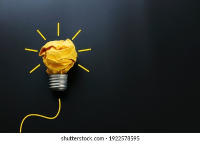 Education concept image. Creative idea and innovation. Crumpled paper as light bulb metaphor over black background - Shutterstock ID 1922578595