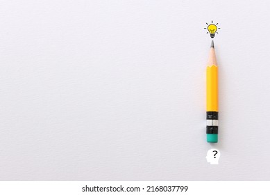 Education concept image. Creative idea and innovation. Pencil and light bulb metaphor over white paper background - Shutterstock ID 2168037799