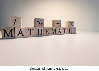 Education concept. Education and math relation. Mathematics, astronomy, economy words with letters from wooden cubes