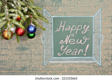 Education concept  Perspectives for the future  Christmas decorations   chalkboard and title: Happy New Year!