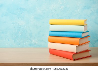 Education concept with stack of books on wooden table - Powered by Shutterstock