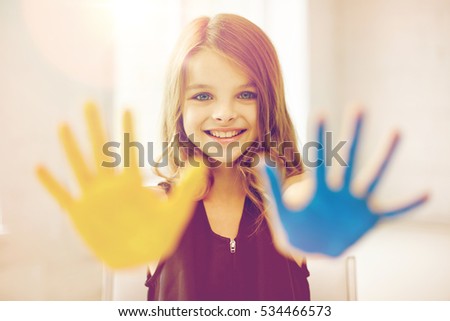 Similar – Foto Bild Mädchen mit bunt lackierten Fingernägeln, hält ein Eis in der Hand vor dem Mund.