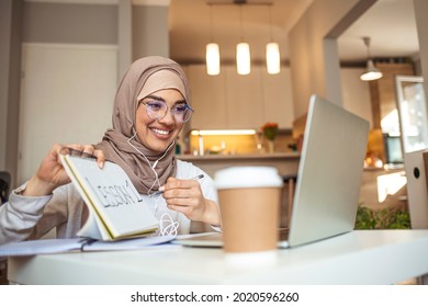 Education and e-learning on universities - using new platforms to share knowledge. Muslim teacher or professor explaining chemistry or other science over internet to students