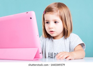 Education, Elementary School, Technology, Advertisement And Children Concept - Little  Girl Using Tablet/ipad/pc On A White Background Girl Ready To Study. Mockup, Place For Text. 