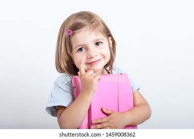 Education, Elementary School, Technology, Advertisement And Children Concept -  Funny Schoolchild Girl With Tablet,iPad,pc And Notebook, Diary On A White Background. Girl Ready To Study. Copy Space