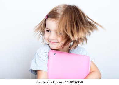 Education, Elementary School, Technology, Advertisement And Children Concept -  Funny Schoolchild Girl With Tablet,iPad,pc And Notebook, Diary On A White Background. Girl Ready To Study. Copy Space