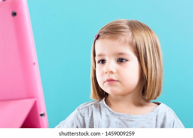 Education, Elementary School, Technology, Advertisement And Children Concept -  Funny Schoolchild Girl With Tablet,iPad,pc And Notebook, Diary On A White Background. Girl Ready To Study. Copy Space