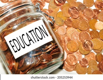 Education fund concept with jar of money