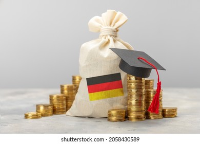 Education In Germany. Money Bag And Germany Flag And Graduate Cap.