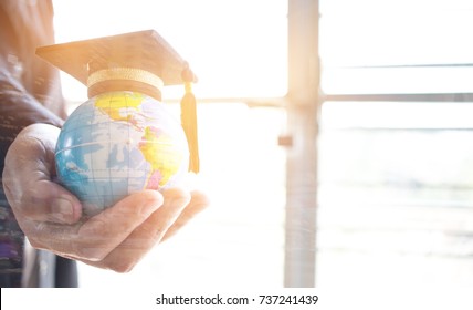 Education in Global, Graduation cap on Businessman holding Earth globe model map with Radar background in hands. Concept of world business, abroad
 international educational, Back to School. - Powered by Shutterstock