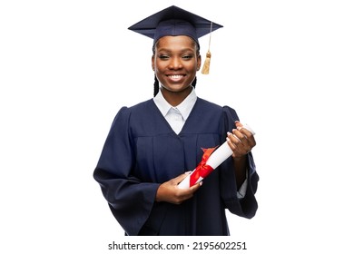 education, graduation and people concept - happy graduate student woman in mortarboard and bachelor gown with diploma - Shutterstock ID 2195602251