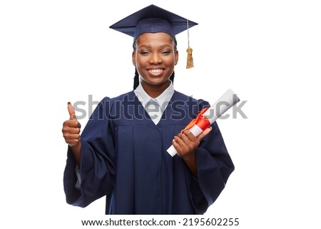 education, graduation and people concept - happy graduate student woman in mortarboard and bachelor gown with diploma showing thumbs up over white background
