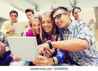 Education, High School, Technology And People Concept - Group Of Smiling Students With Tablet Pc Computers Taking Photo Or Video Indoors