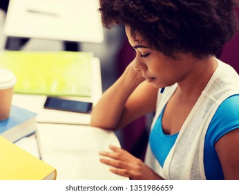 education, high school, university, learning and people concept - african student girl with books and coffee on lecture