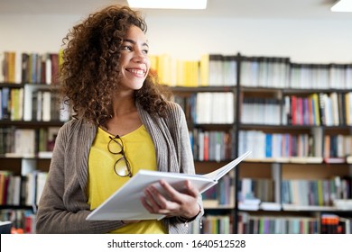 Education, High School, University, Learning And People Concept. Smiling Student Girl Reading Book