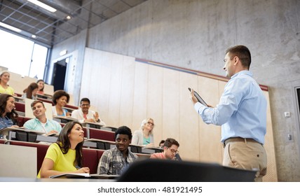 Education, High School, University, Teaching And People Concept - Group Of International Students And Teacher With Tablet Pc Computer Standing At White Board At Lecture