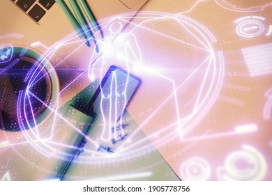 Education hologram drawings over computer on the desktop background. Top view. Multi exposure. - Shutterstock ID 1905778756