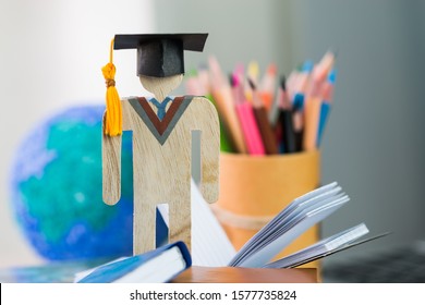 Education knowledge learning study abroad international Ideas. People Sign wood with graduation celebrating cap on book with model global, alternative studying distant for learn. Back to School
