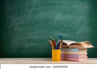 Education and reading concept - group of colorful books on the wooden table - Shutterstock ID 1465393592