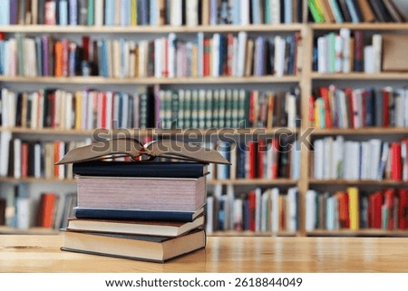 education, reading, learning, studying, knowledge, literature,education background, Romance novel, crime novel, historical novel, collection of poems,stack of  books on the table, High quality photo