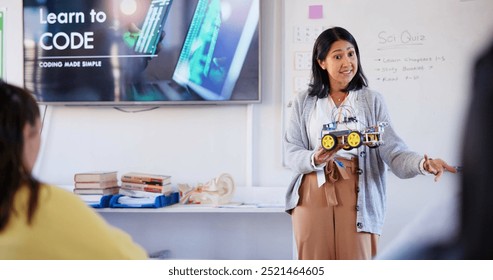 Education, robotics and lecture with teacher in classroom for learning, scholarship or tech bootcamp. Coding, Ai development and future with people at STEM school for course, programming or academy - Powered by Shutterstock