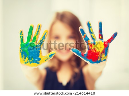 Similar – Foto Bild Mädchen mit bunt lackierten Fingernägeln, hält ein Eis in der Hand vor dem Mund.