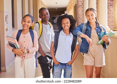 Education, school and children portrait for learning support, group project and diversity happiness in hall together. Studying, books and backpack of youth friends, students or kids in teamwork smile - Powered by Shutterstock