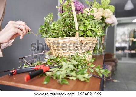 Similar – Hands make bouquet in vase