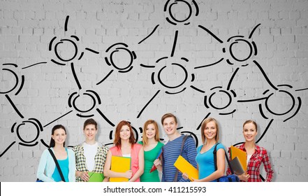 education, school and people concept - group of smiling teenage students with folders and school bags over gray brick wall background with network drawing - Shutterstock ID 411215593