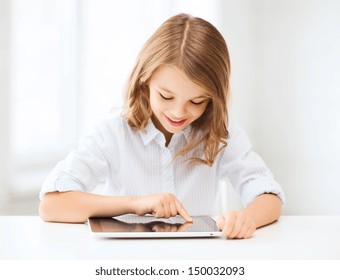 education, school, technology and internet concept - little student girl with tablet pc at school - Powered by Shutterstock