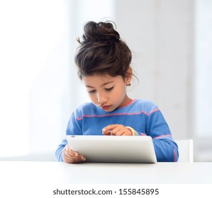 Education, School, Technology And Internet Concept - Little Student Girl With Tablet Pc At Home