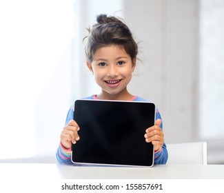 Education, School, Technology And Internet Concept - Little Student Girl With Tablet Pc At Home