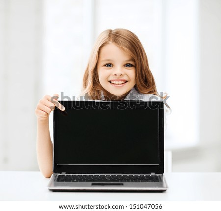 Similar – Happy child with laptop computer on brick background