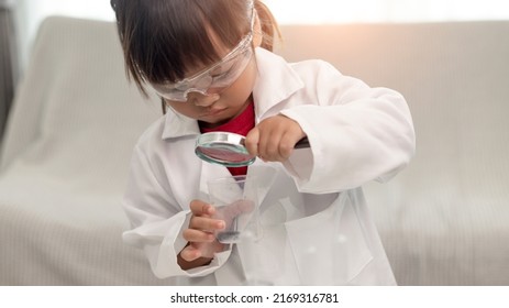 education, science, chemistry, and children concept - kids or students with test tube making experiment at school laboratory