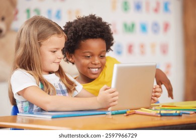 Education, tablet and team of kids in classroom for learning together or study in preschool school. Students, technology or happy children with development, puzzle app or reading for digital literacy