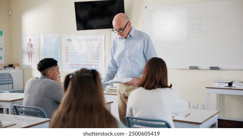 Education, teacher and papers with results in high school, biology and lesson for learning and development. Male person, classroom and presentation for feedback, grades or science project by students - Powered by Shutterstock