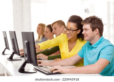 Education, Technology And School Concept - Smiling Students In Computer Class At School