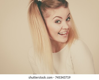 Education, teenage adolescence, happiness concept. Happy blonde teenager student girl with ponytails