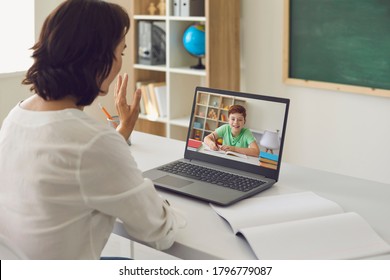 Education training teaching online. Woman teacher greets student child using laptop online video call. - Powered by Shutterstock