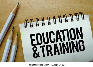 Education & Training Text Written On A Notebook With Pencils