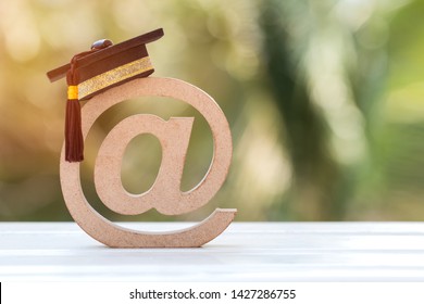 Education University of online training courses or distance learning in abroad international study concept: Graduation cap on email address symbol.Communication school can learn by internet technology