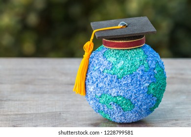 Education World Or Graduated Study Abroad International Ideas. Graduation Hat On Top Paper Mache Craft Earth Globe. Concept Of Congratulations To Graduates University Lead To Success In World Amd Life